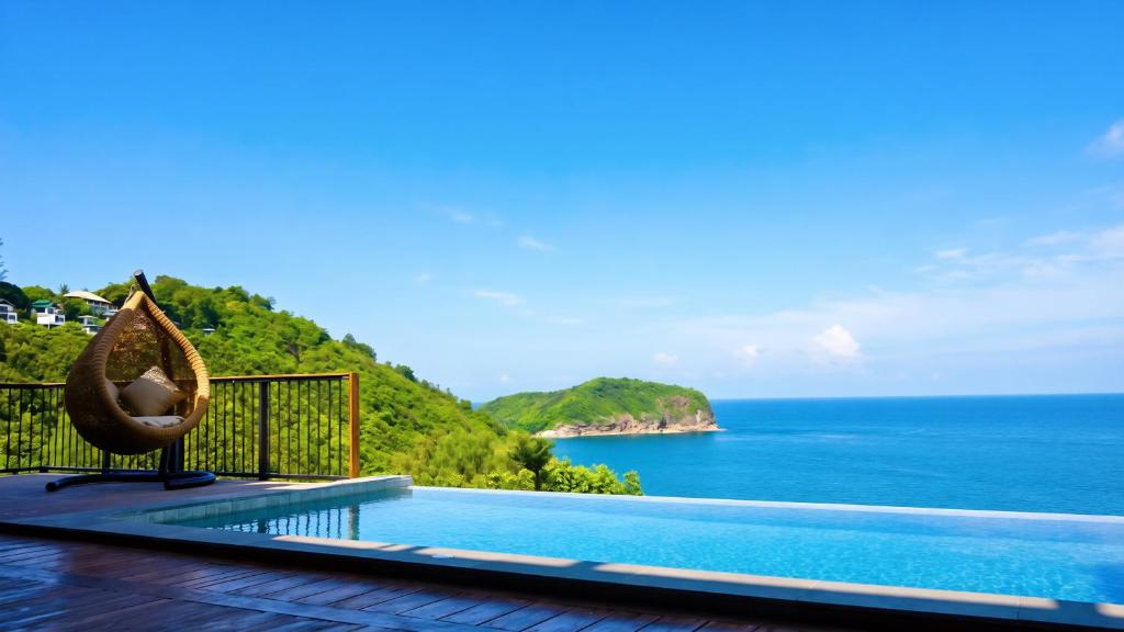 ein Pool mit Hängematte und Meerblick in der Unterkunft yume17 - Sea View pool Villas & 1BD, Studios in Chaloklum