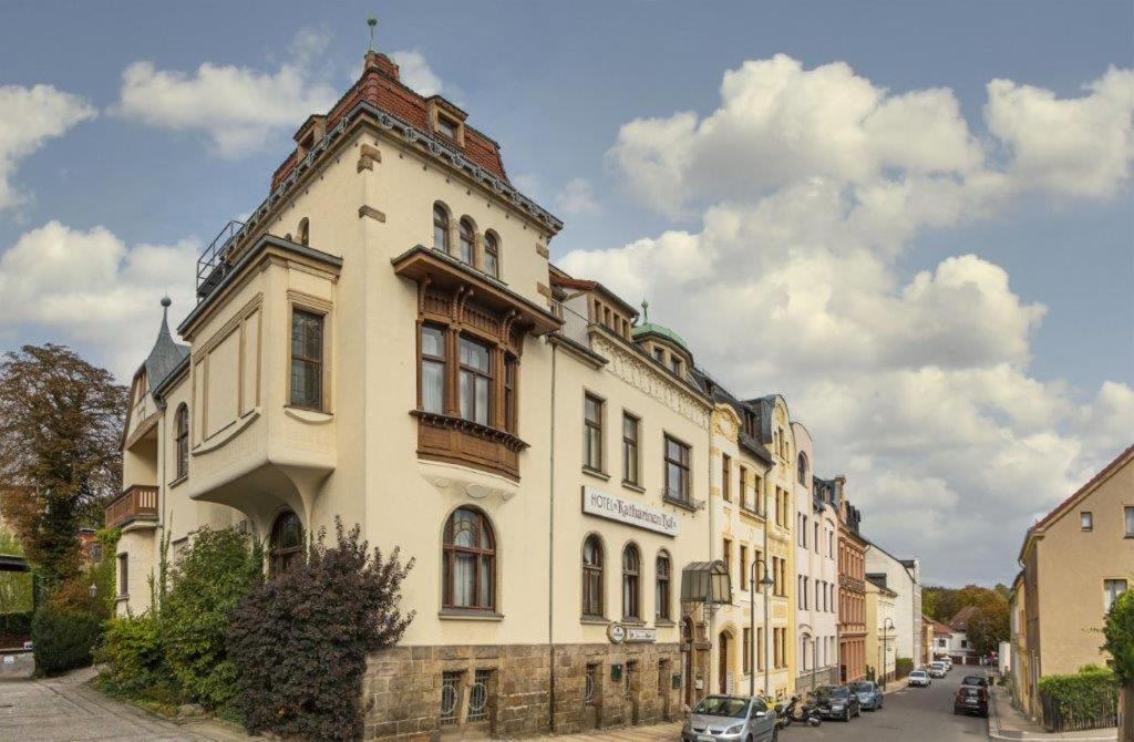 a large building on the side of a street at Hotel Katharinenhof in Werdau