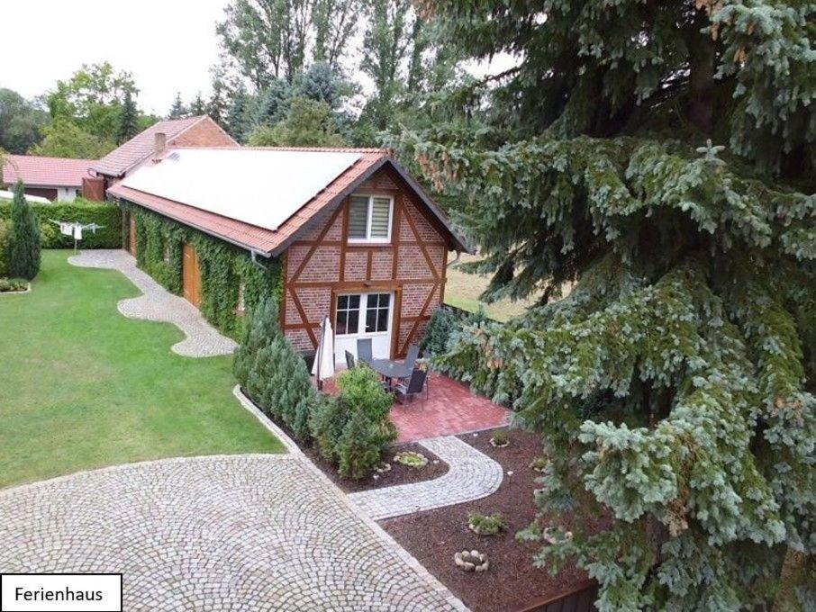 a small house with a pathway leading to it at Ferienwohnung Buschmühle Schlepzig in Schlepzig