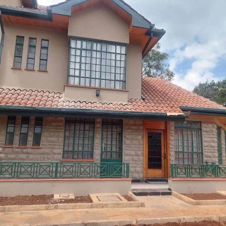 a house with a red roof at HARMONY GUEST house in Nairobi