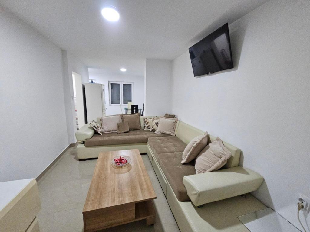a living room with a couch and a coffee table at Beogradski mir in Belgrade
