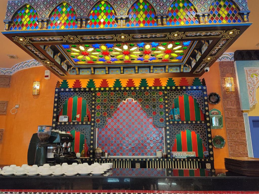 a room with a altar with a stained glass ceiling at Hotel Maamoura in Casablanca