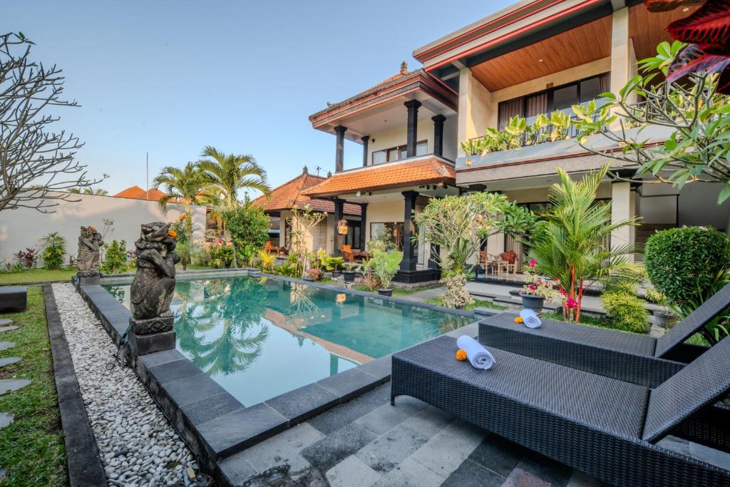 an image of a villa with a swimming pool at Sari Bungalow in Ubud