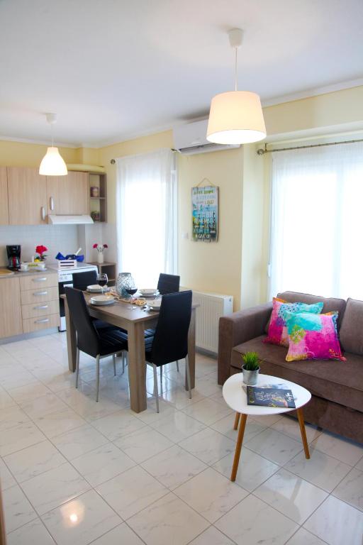 a living room with a couch and a table at Apartments Holiday in Perea