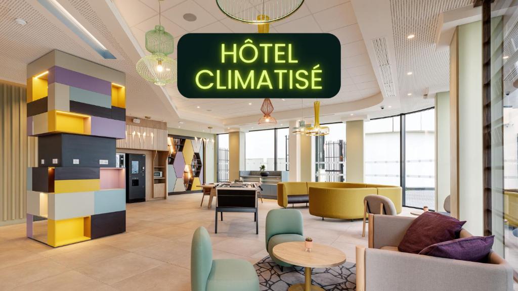 a hotel climate sign hanging in a hotel lobby at B&B HOTEL Lille Lillenium Eurasanté in Lille