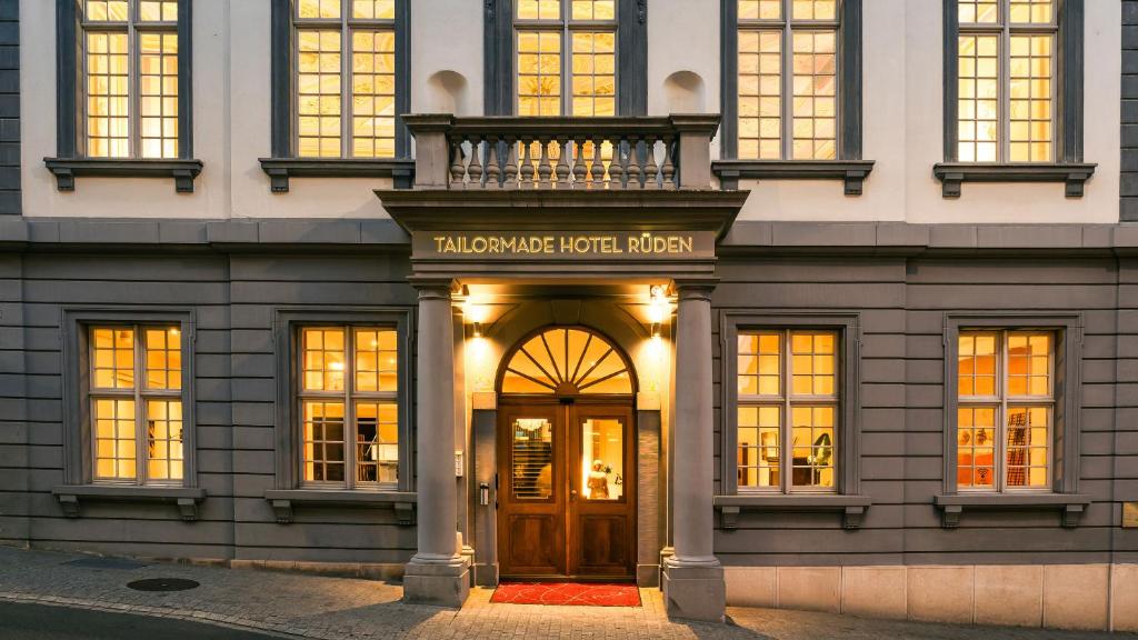 a building with a door in front of it at Tailormade Hotel RÜDEN Schaffhausen in Schaffhausen