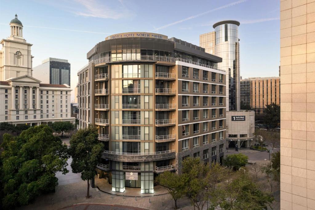 a rendering of a tall building in a city at Protea Hotel by Marriott Cape Town North Wharf in Cape Town