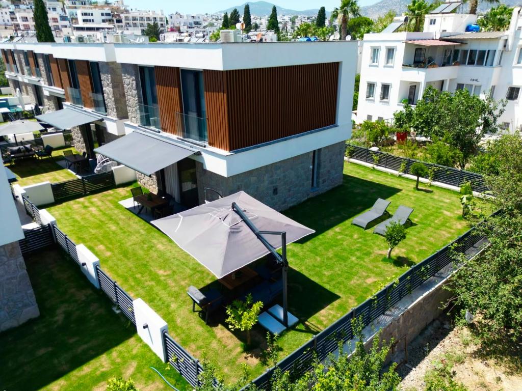 an aerial view of a building with a lawn at Prime Bodrum Villas in Bodrum City