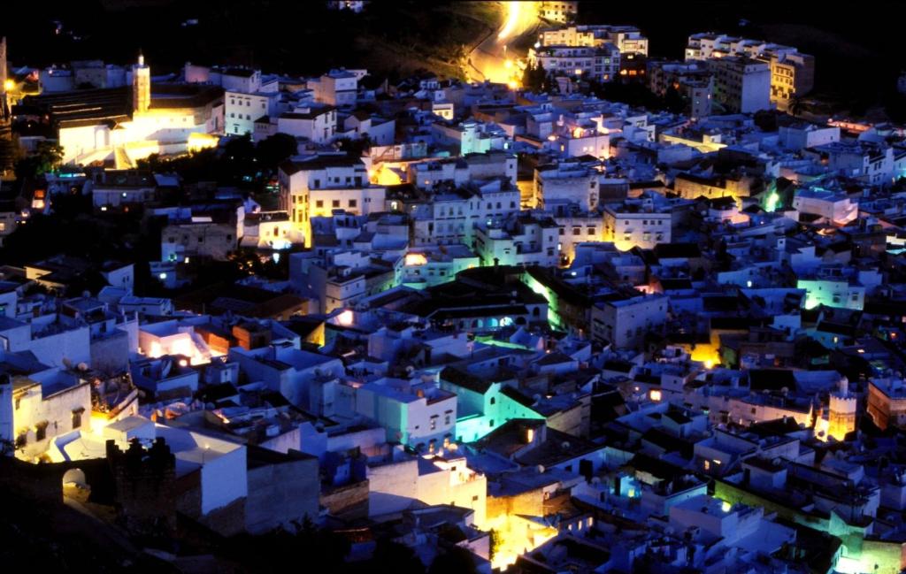 a view of a city at night at Dar Yassir in Chefchaouen