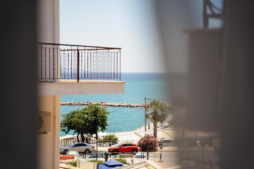 a view of the ocean from a balcony of a building at Zoe Apartment Port View Β in Rafina