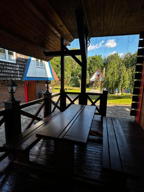 a wooden table sitting inside of a building at Goralské chalupy in Zálesie