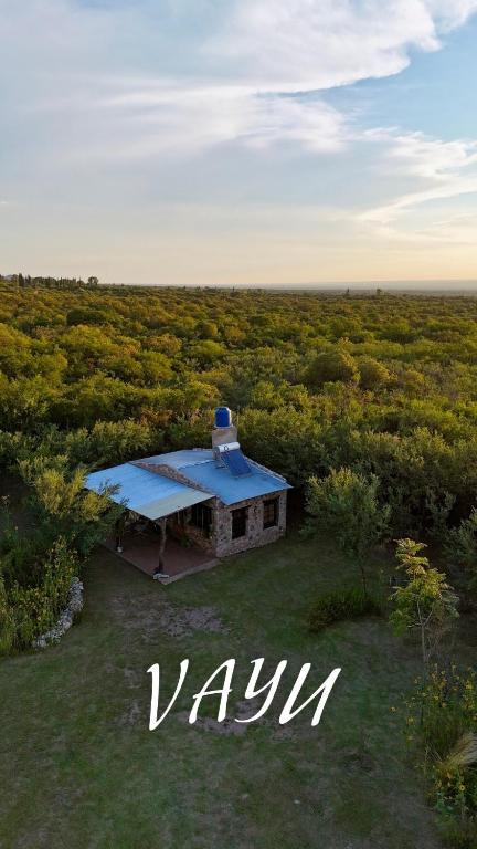 a small house in the middle of a field at Vayu- en La Casa de Nanda in San Javier
