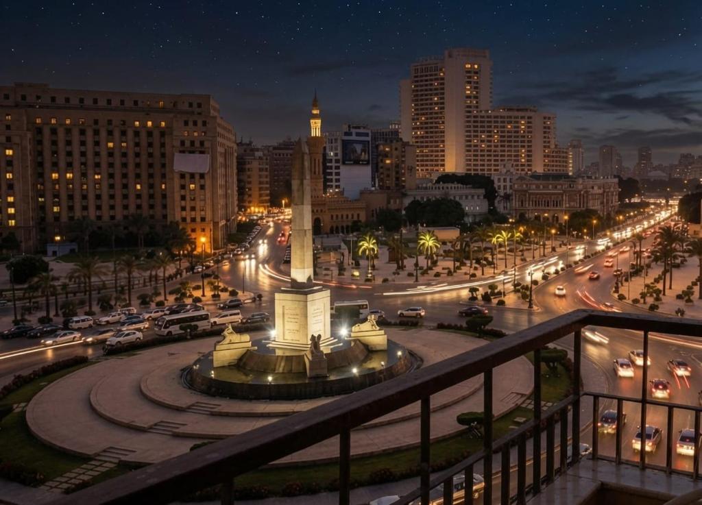 a view of a city at night with traffic at Up Town Crown Hotel in Cairo