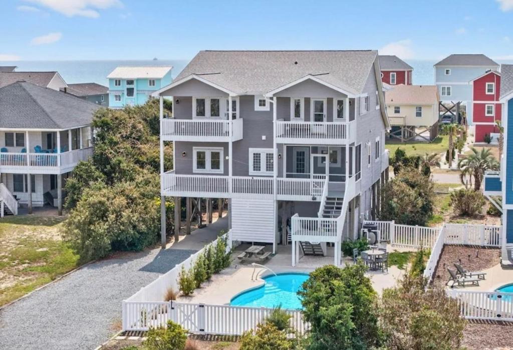 an aerial view of a large house with a pool at Mischief Managed NC in Oak Island