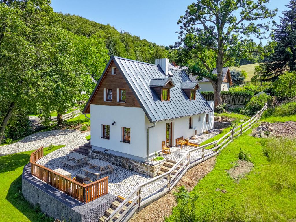 an aerial view of a house with a metal roof at NatureHouse Čeřeniště in Malečov