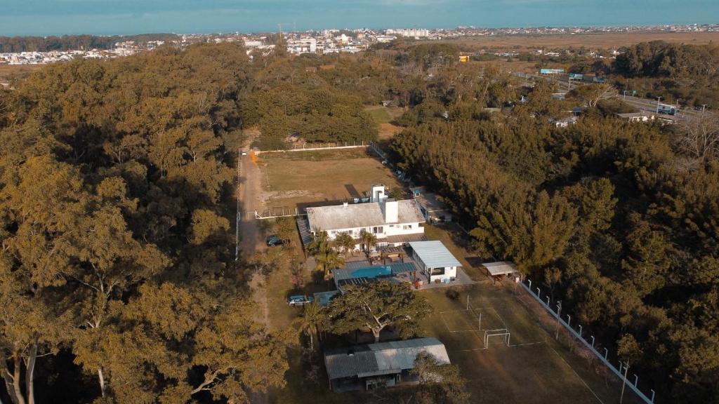 an aerial view of a house in the middle of a forest at Pousada Recanto das Cerejeiras in Rio Grande