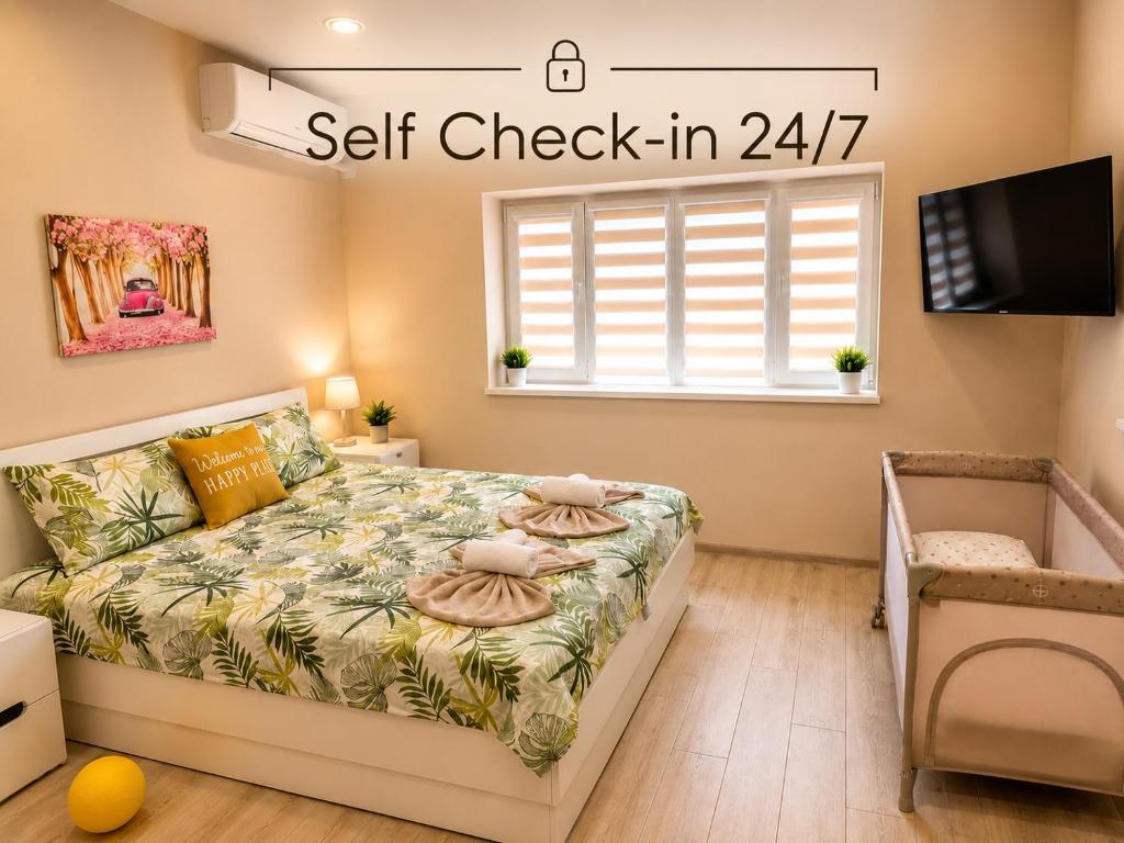 a bedroom with a bed with a self check in at Apartment Be Happy 3, Premium Apartment in Ruse City Centre in Ruse