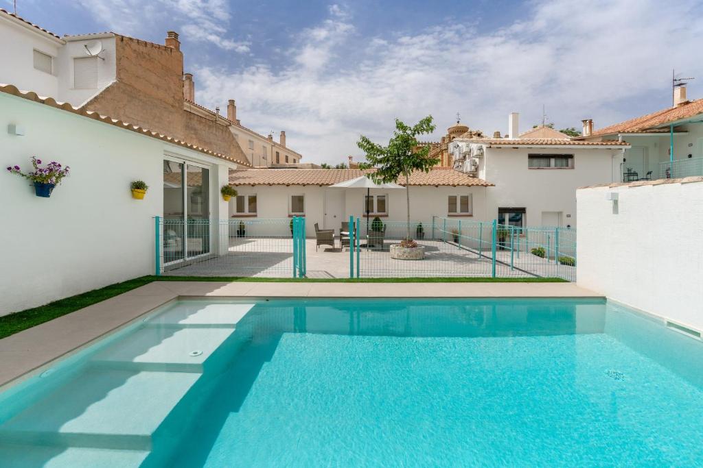 a swimming pool in the backyard of a house at Raízes 22 - Apartamento 4 in Puebla de Don Fadrique
