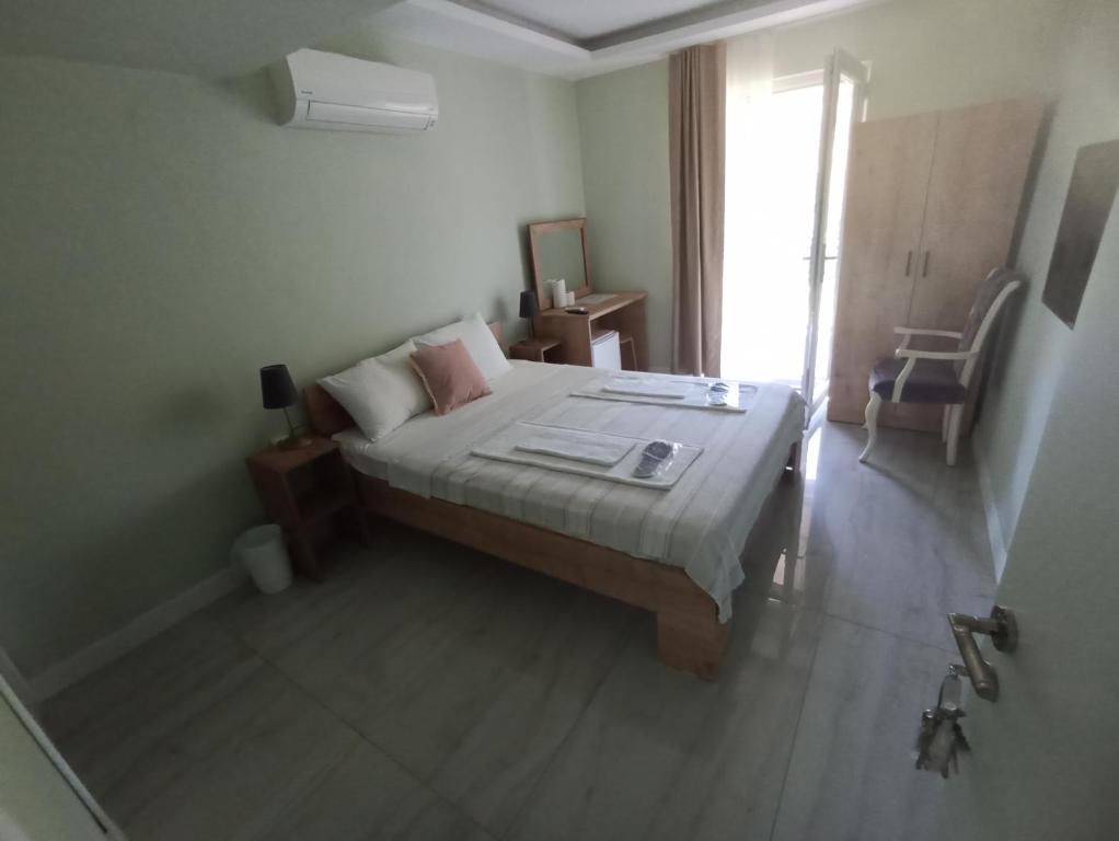 a bedroom with a large bed and a window at Mercan Otel in Kandıra