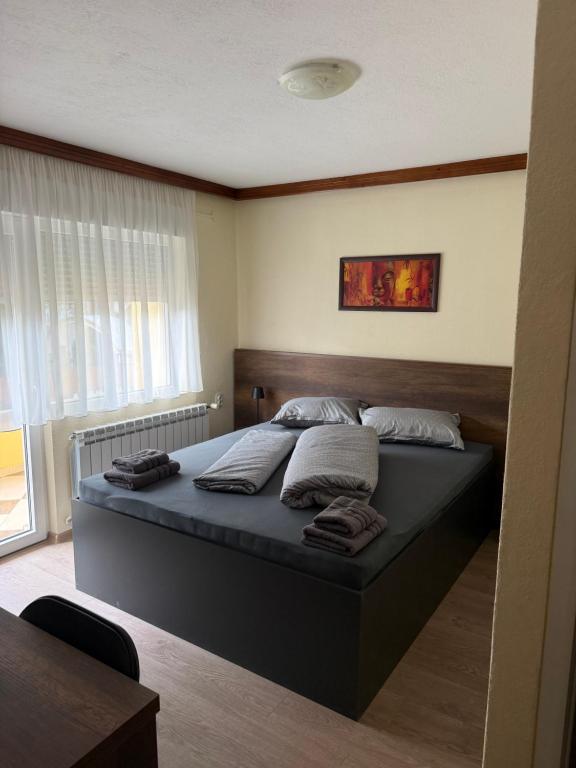 a bedroom with a bed in a room at Руми in Velingrad