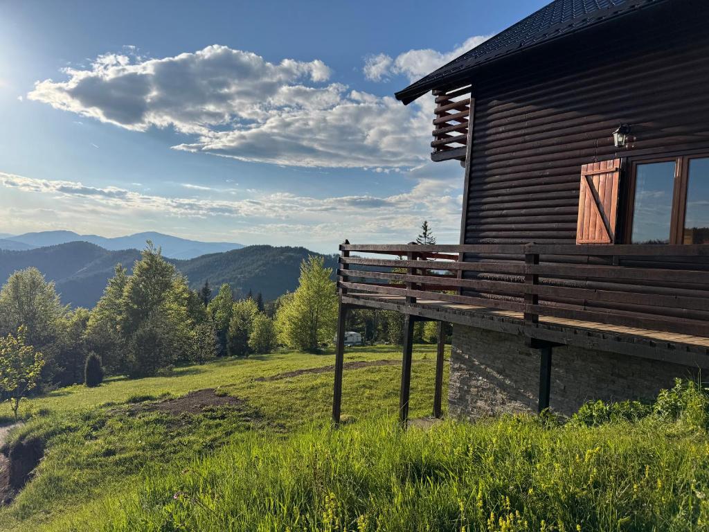 a wooden cabin with a bench in front of it at Brvnara Jevtic, Tara in Mokra Gora