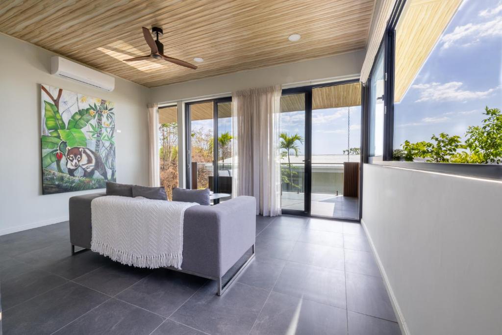 a bedroom with a bed and a ceiling fan at Solindo Suite in Marbella