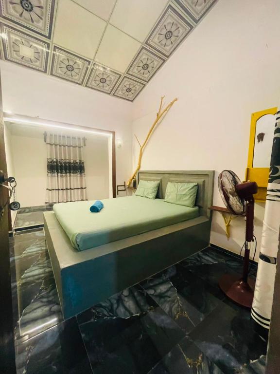 a bedroom with a bed in a room at Angry birds rooms in Habarana