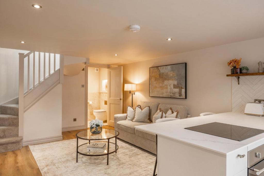 a living room with a couch and a table at The Annexe in Cobham