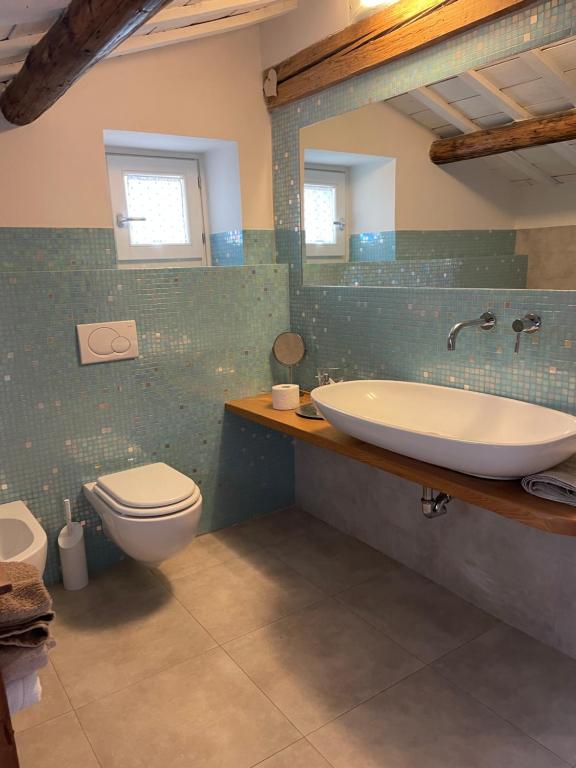 a bathroom with a sink and a toilet at BnB Centro Centro in Ascoli Piceno