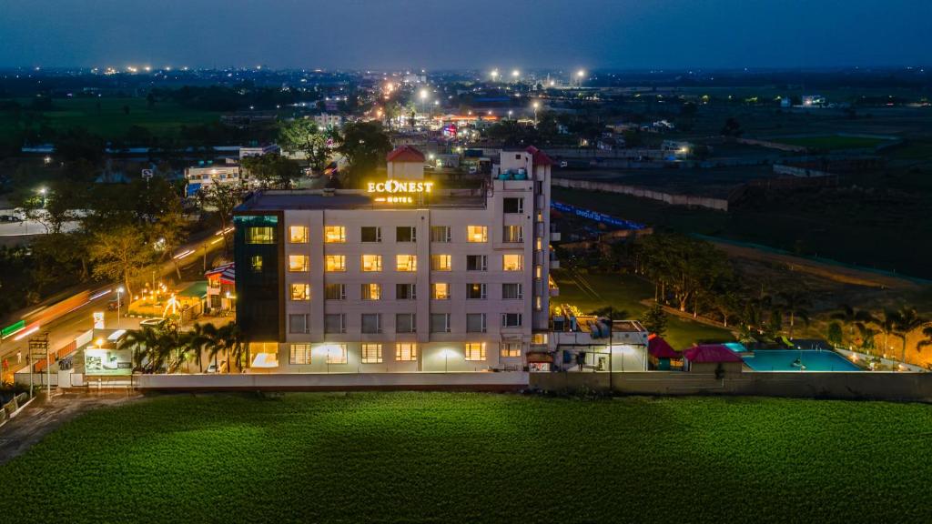 an aerial view of a hotel at night at ECONEST HOTEL in Tarapith