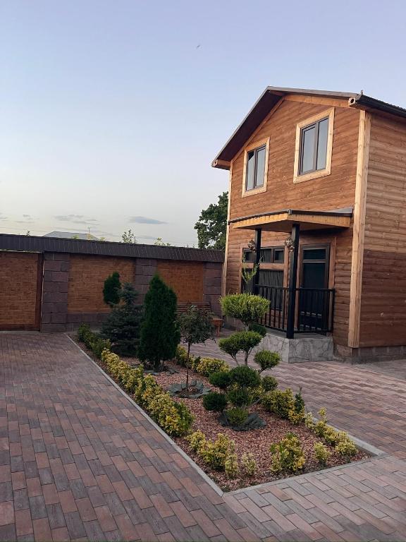 a house with a brick driveway in front of it at ARBAT house LUXURY in Arbatʼ