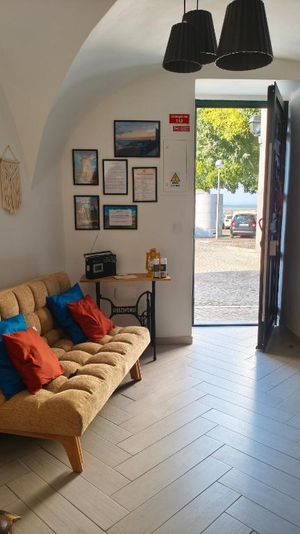 a living room with a couch and a table at Mirador in Beja