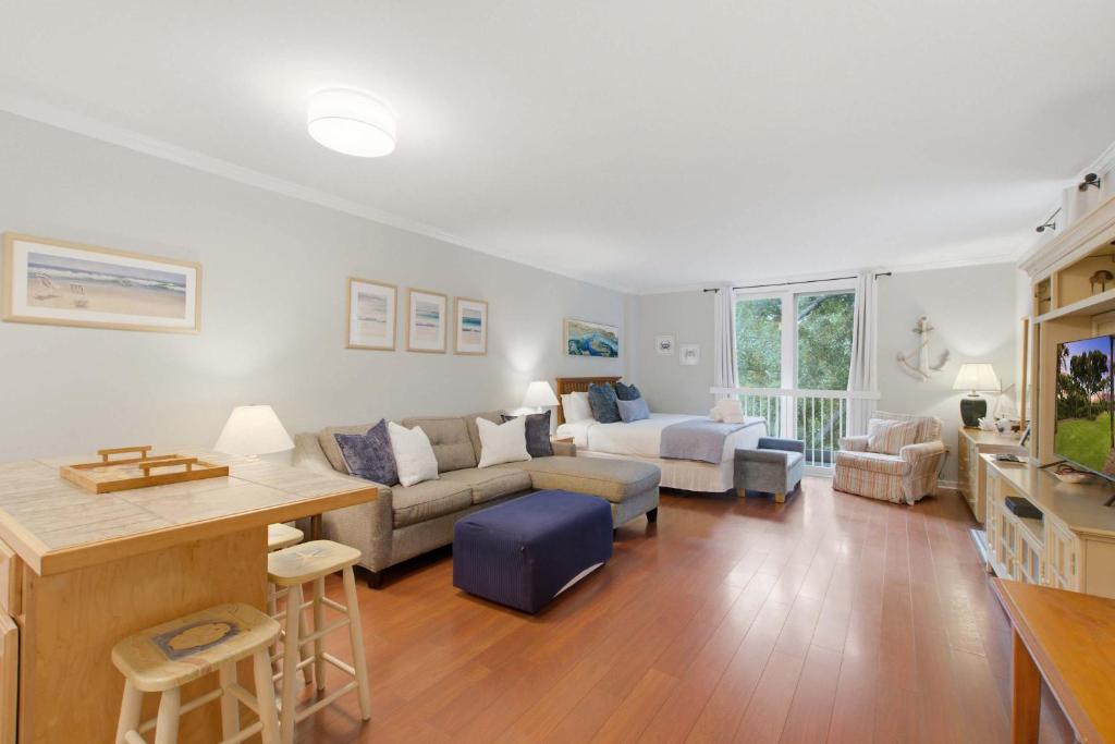 a living room with a couch and a table at 2479 Shipwatch in Kiawah Island