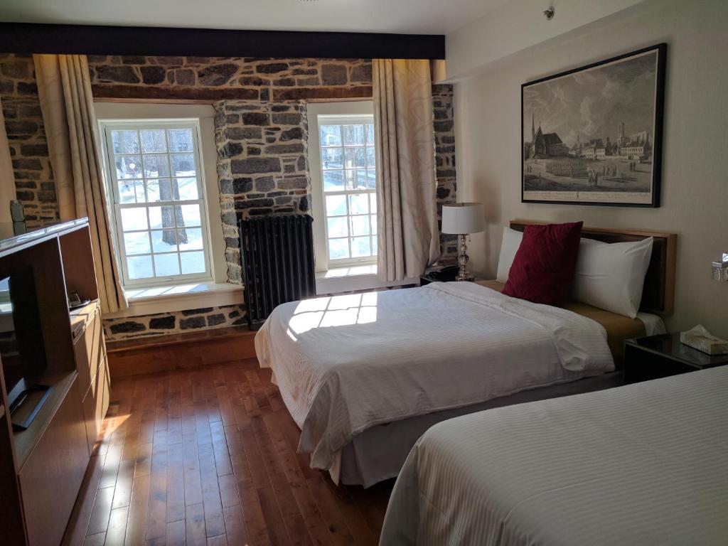 Postel nebo postele na pokoji v ubytování Auberge du Trésor