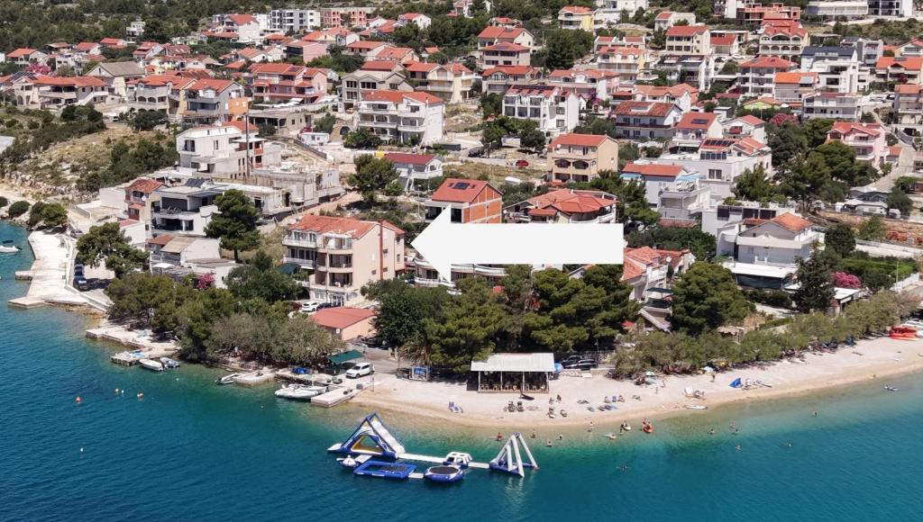 an aerial view of a beach with boats in the water at Open Sea Apartmani in Grebaštica