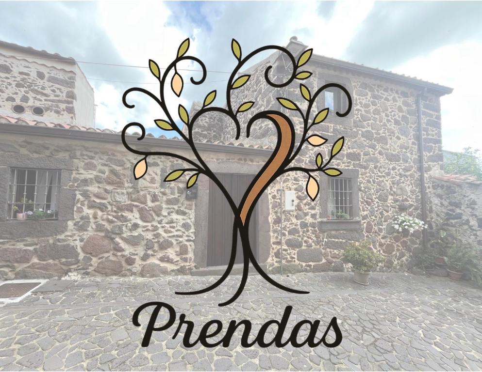 a metal picture of a tree in front of a house at Prendas Paulilatino in Paulilatino
