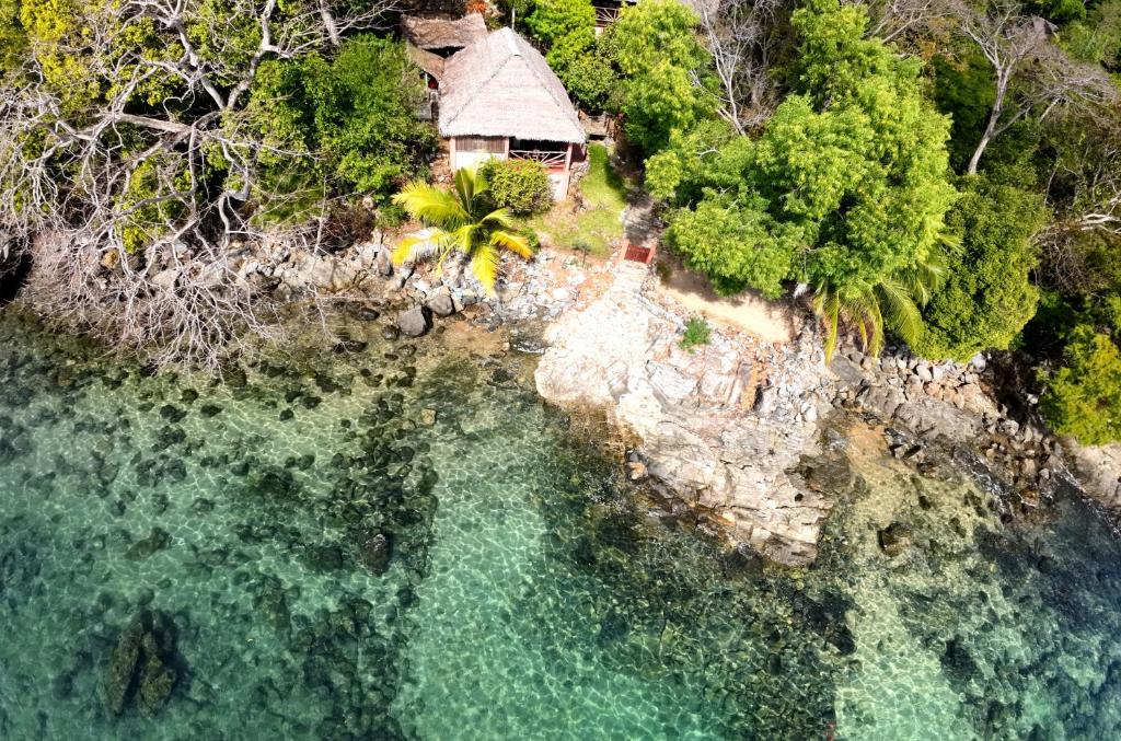 an aerial view of a house next to the water at Manta be à Nosy Komba in Ampangorinana