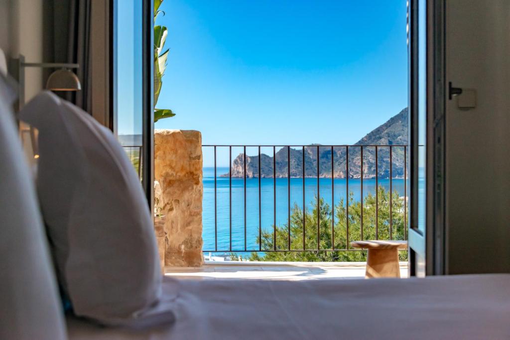 a room with a view of the ocean from a balcony at Santa Barbara by Santas Hotels in Altea