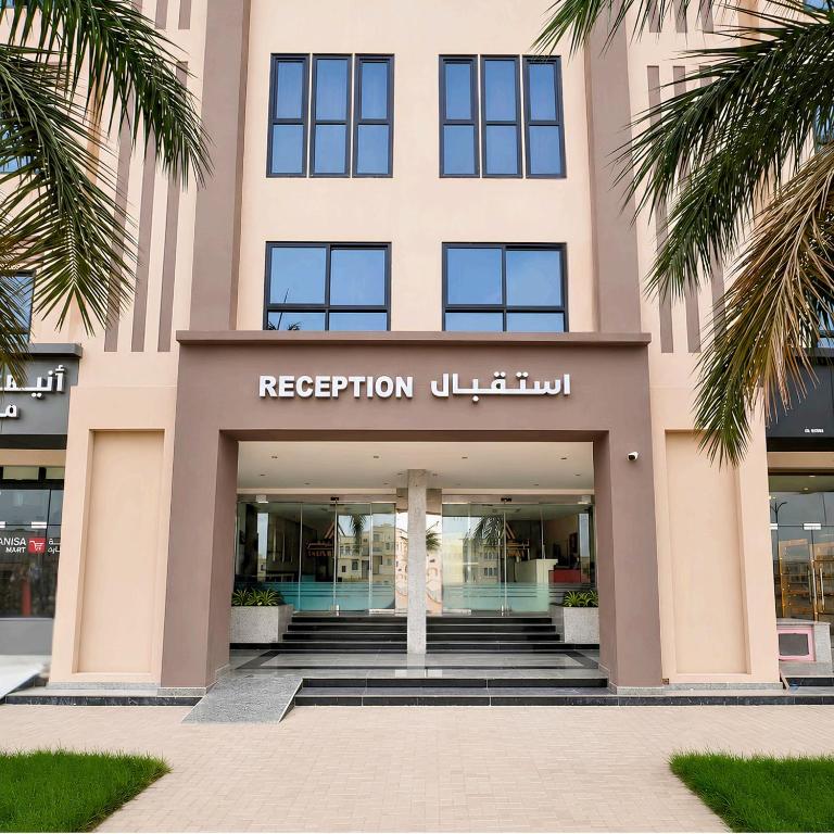 a facade of a building with a reception lobby at Anisa Residence in Salalah