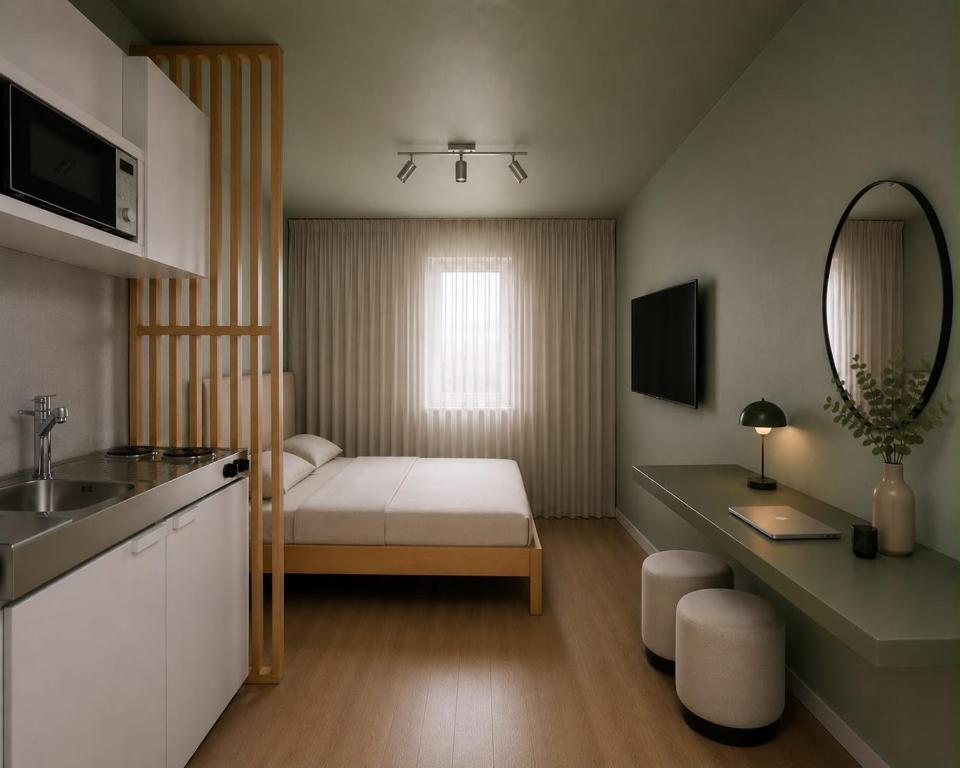 a small bedroom with a bed and a mirror at smart studios - by kalm stay in Munich