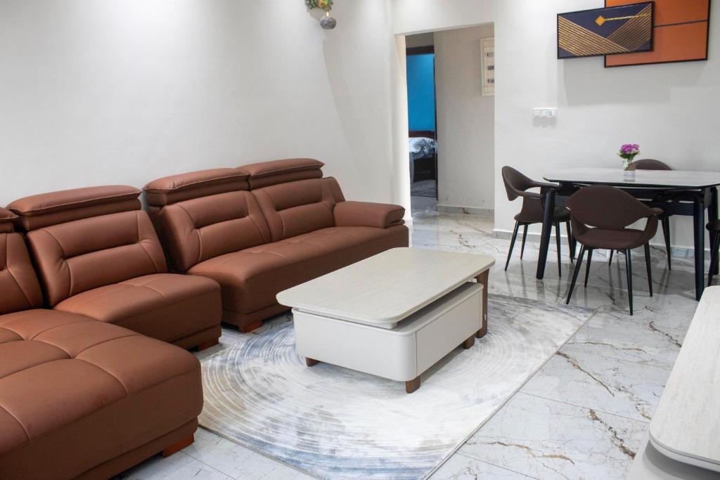 a living room with a couch and a table at Bralph-k in Yaoundé