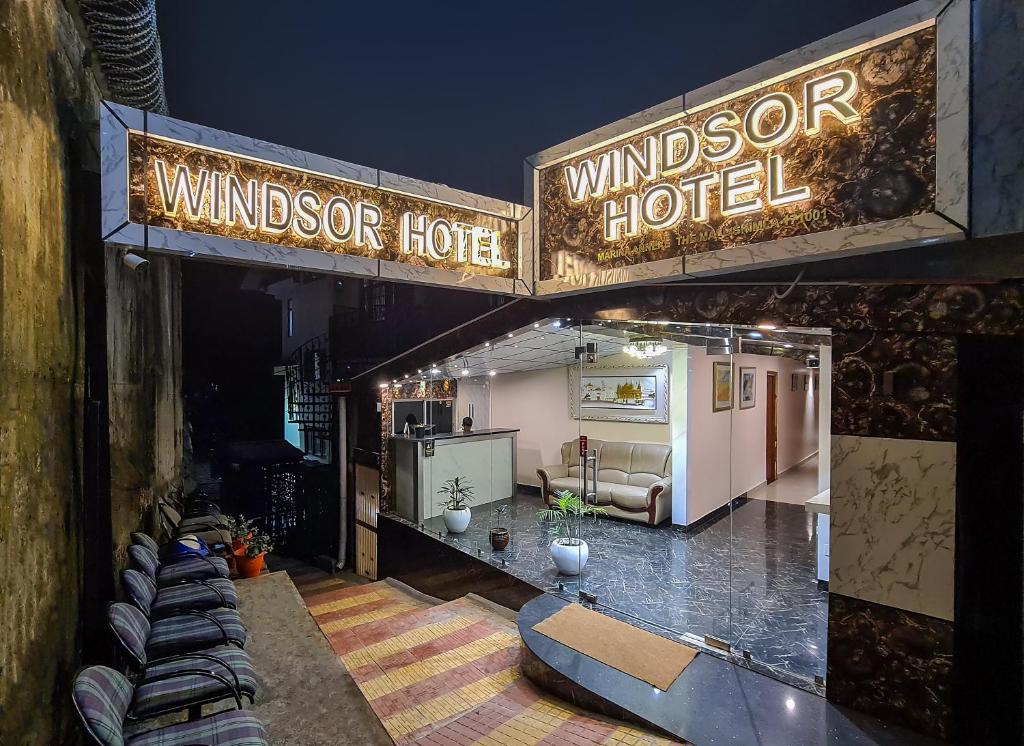 a sign for a windsor hotel in a room at Hotel Windsor in Shimla