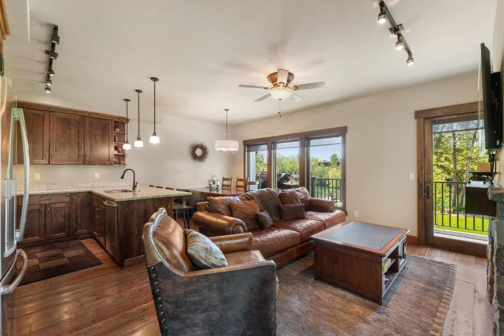 a living room with a couch and a table at Landing A in Whitefish