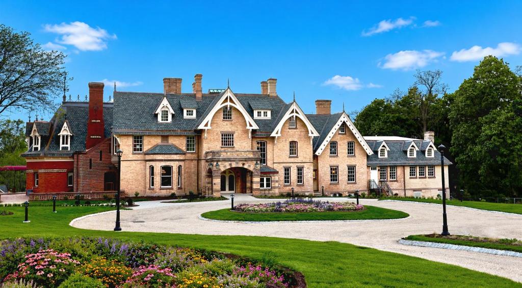 a large brick house with a driveway at Mirbeau Inn & Spa Beacon in Beacon