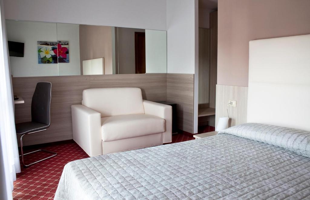 Posteľ alebo postele v izbe v ubytovaní Albergo Ristorante Belvedere