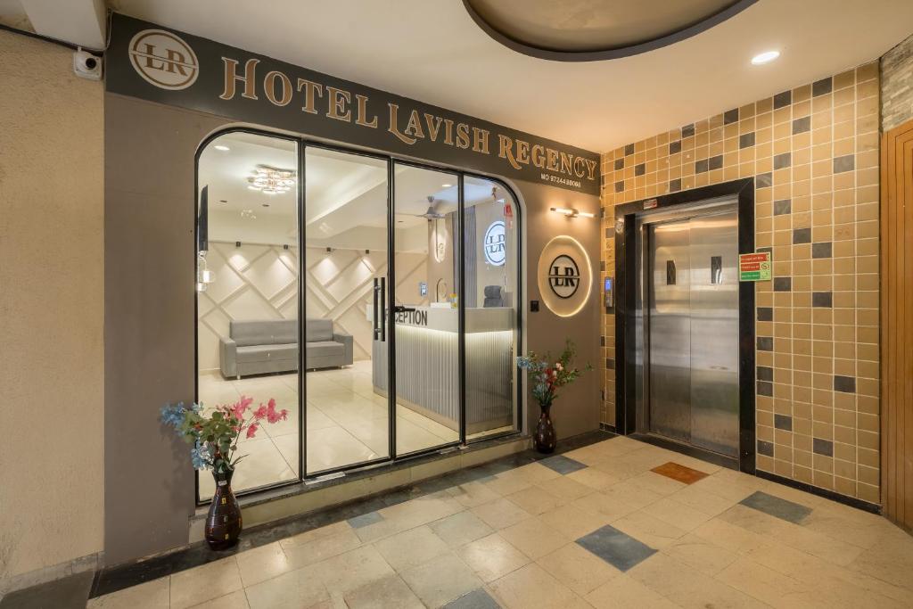 a hotel lobby with a store window with flowers at Hotel Lavish Regency in Ahmedabad