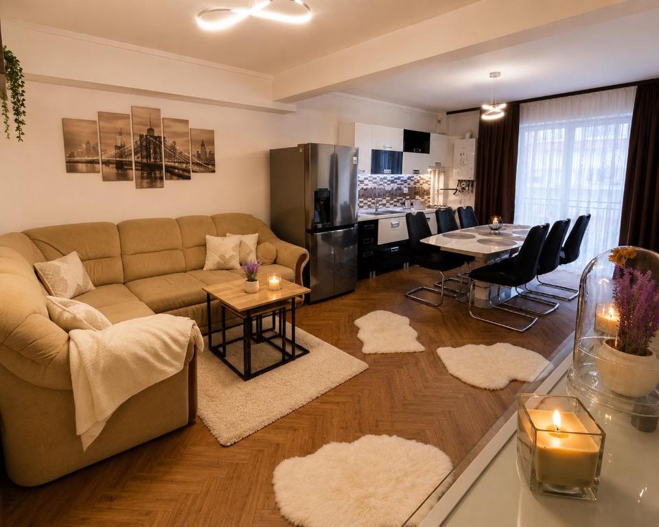 a living room with a couch and a table at Yoa Apartaments in Floreşti