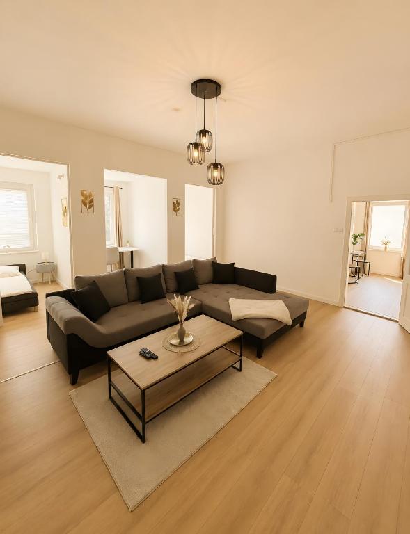 a living room with a couch and a coffee table at Theaterblick Hildesheim in Hildesheim