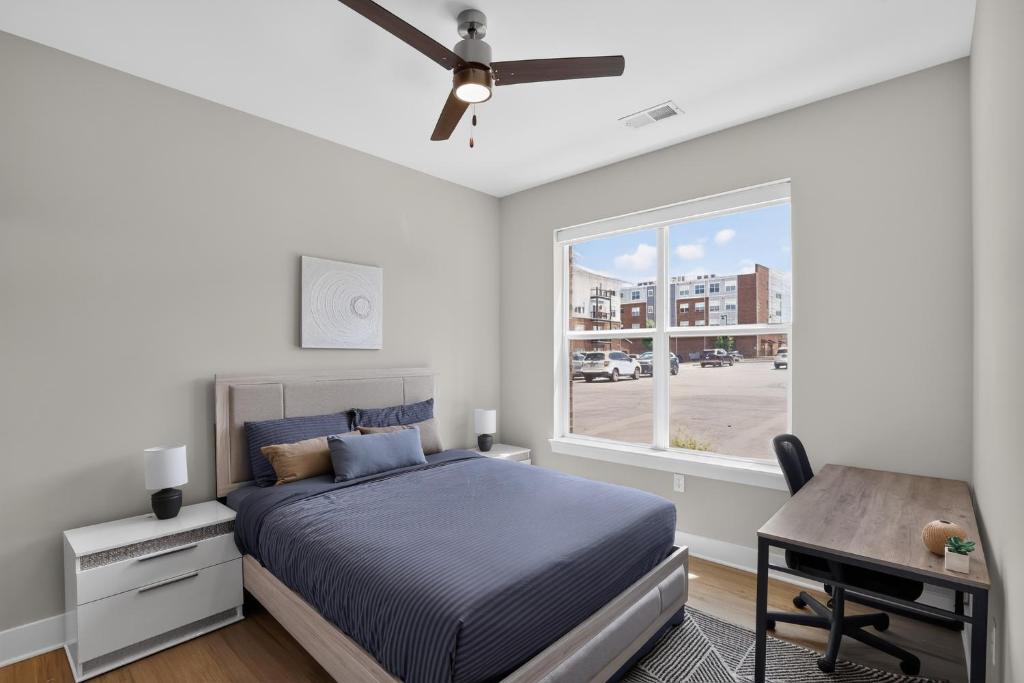 a bedroom with a bed and a window and a desk at Homey 2BR with Great Space in Greer