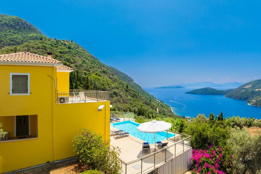 a villa with a pool and a view at Villa Inna in Mikros Gialos